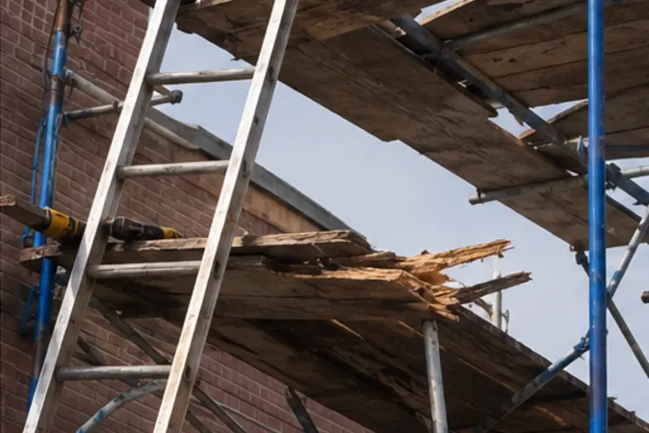 Construction injury attorney investigating unsafe scaffolding in Queens