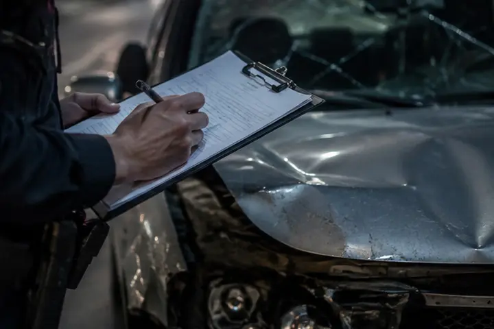 DUI accident lawyer reviewing evidence from a Forest Hills collision